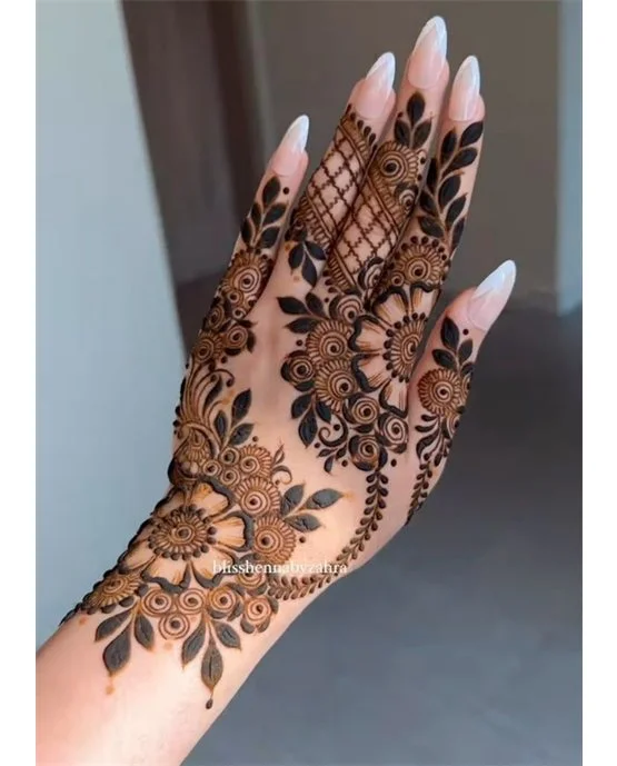 Chic Weave And Floral Covering Back Hand Mehndi Design Chic Weave And Floral Covering Back Hand Mehndi Design